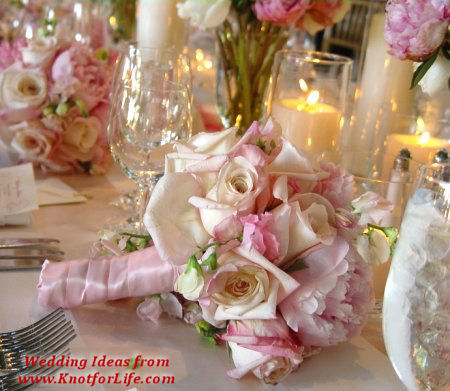 Pink Rose Bouquets with Place Settings on Dining Table